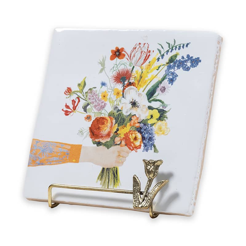 Gouden tegelhouder in standaard met een bloemenafbeelding