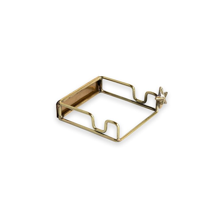 Gouden tegelhouder met stervormig detail in minimalistische stijl