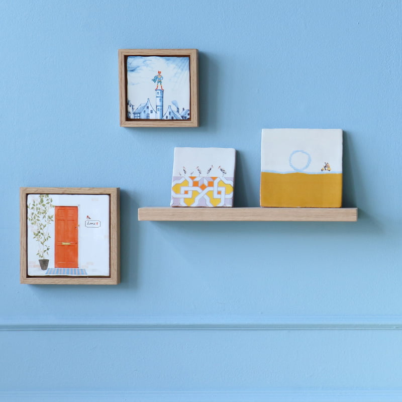 Tegeltje huiselijke kunst blauwe kamerstelling kleurenwand presentatie zonder grenzen