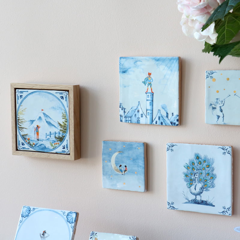 Tegeltjes met verschillende blauwe illustraties