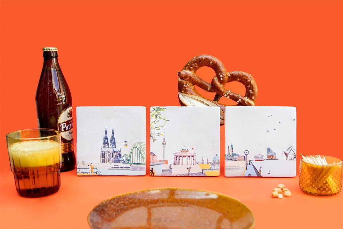 Tegeltjes Duitsland met stadsgezichten op oranje achtergrond