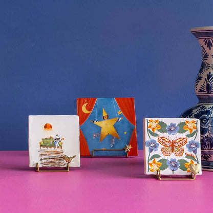 Tegeltjes met illustraties van sofa, ster en vlinder