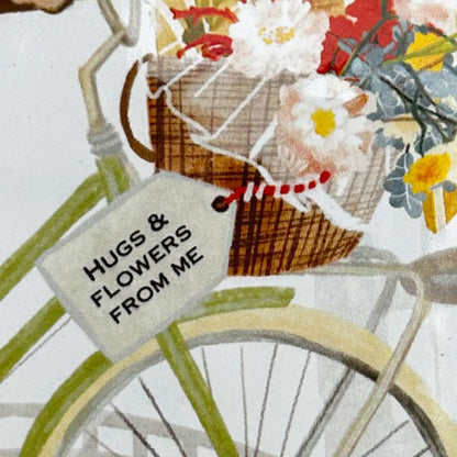 Inzoom op personalisatie tegeltje Vrolijkheid in een fietsmand